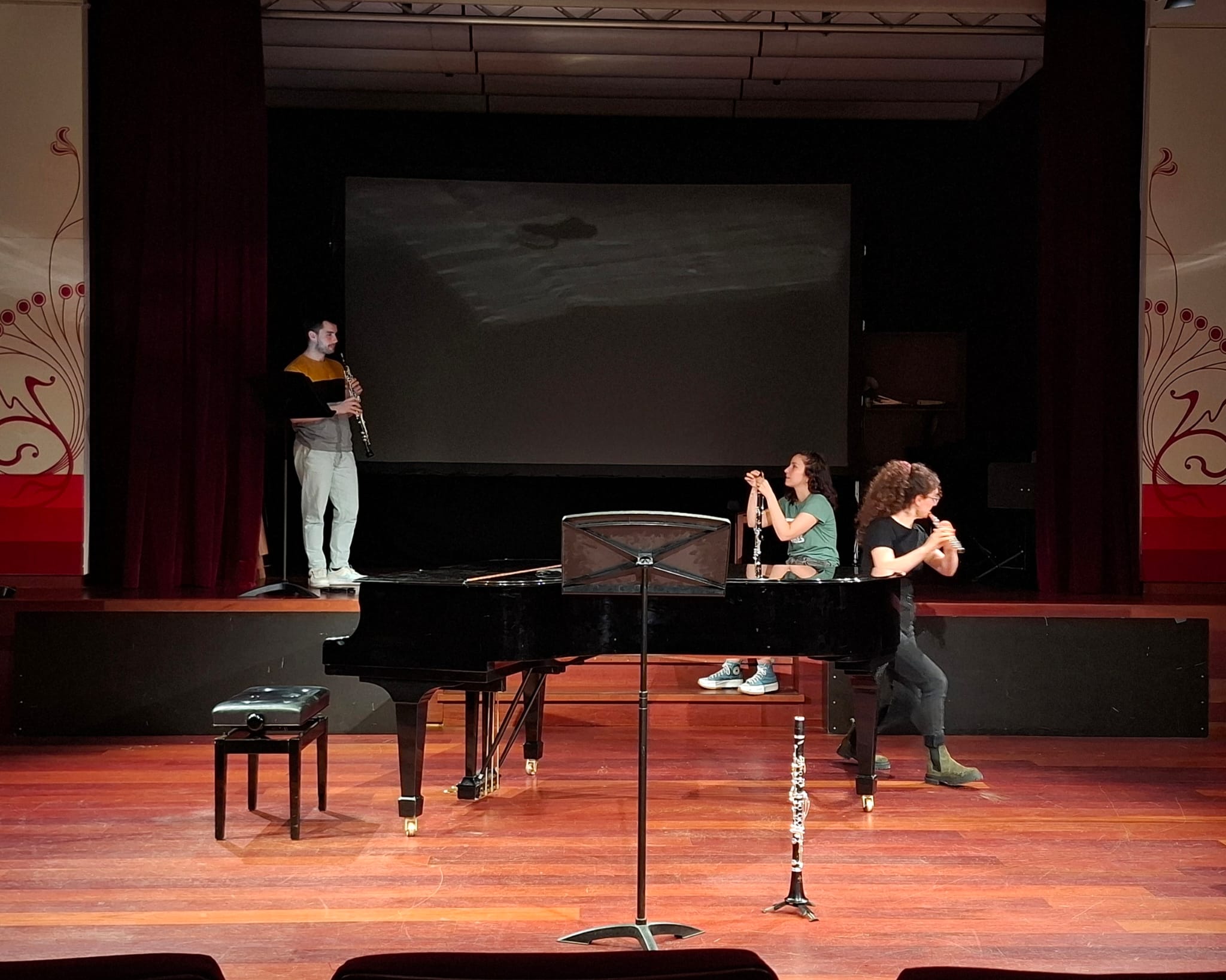 Aer Clave Ensemble rehearsing on stage