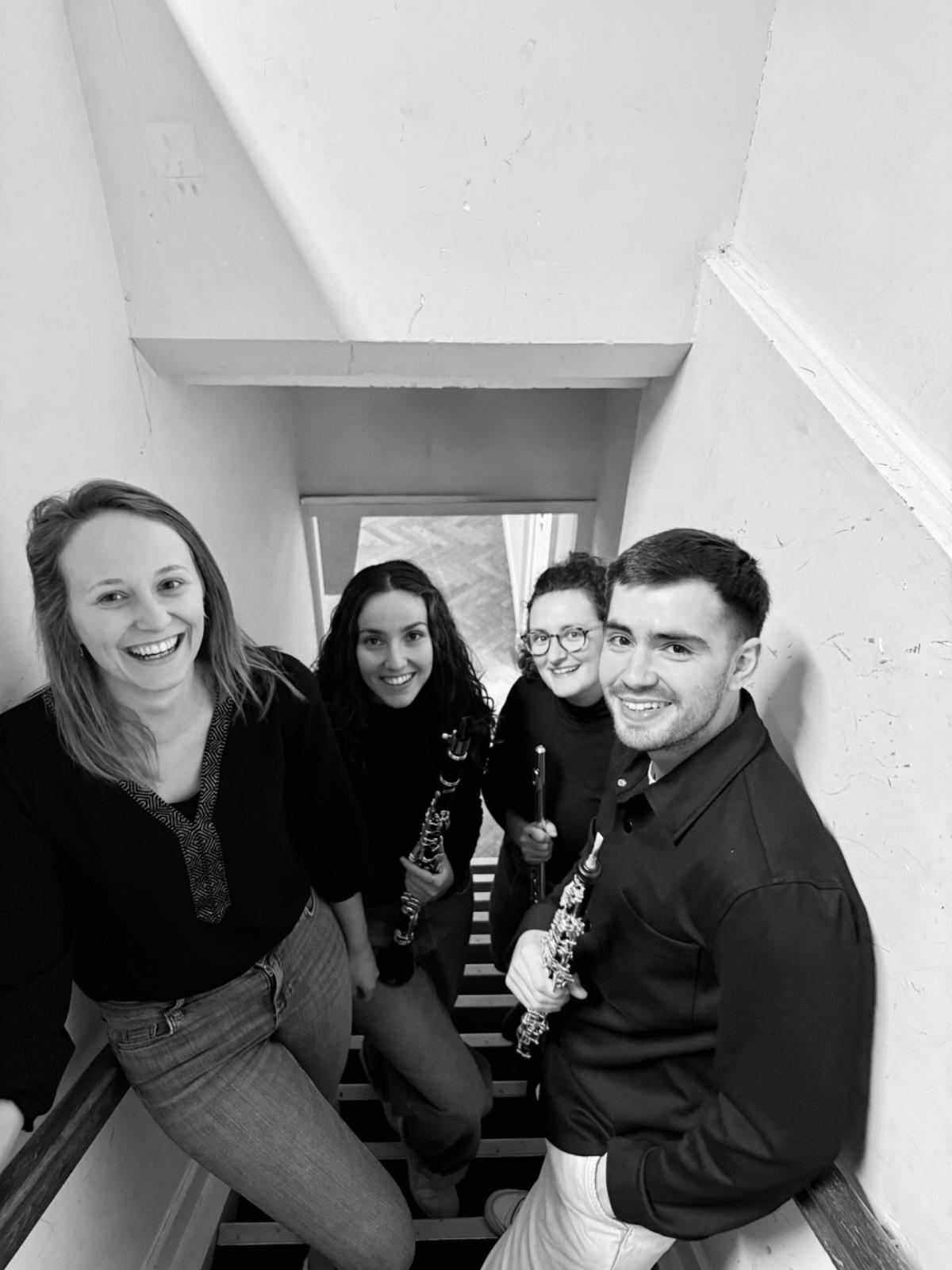 Aer Clave Ensemble on a staircase, seen from above