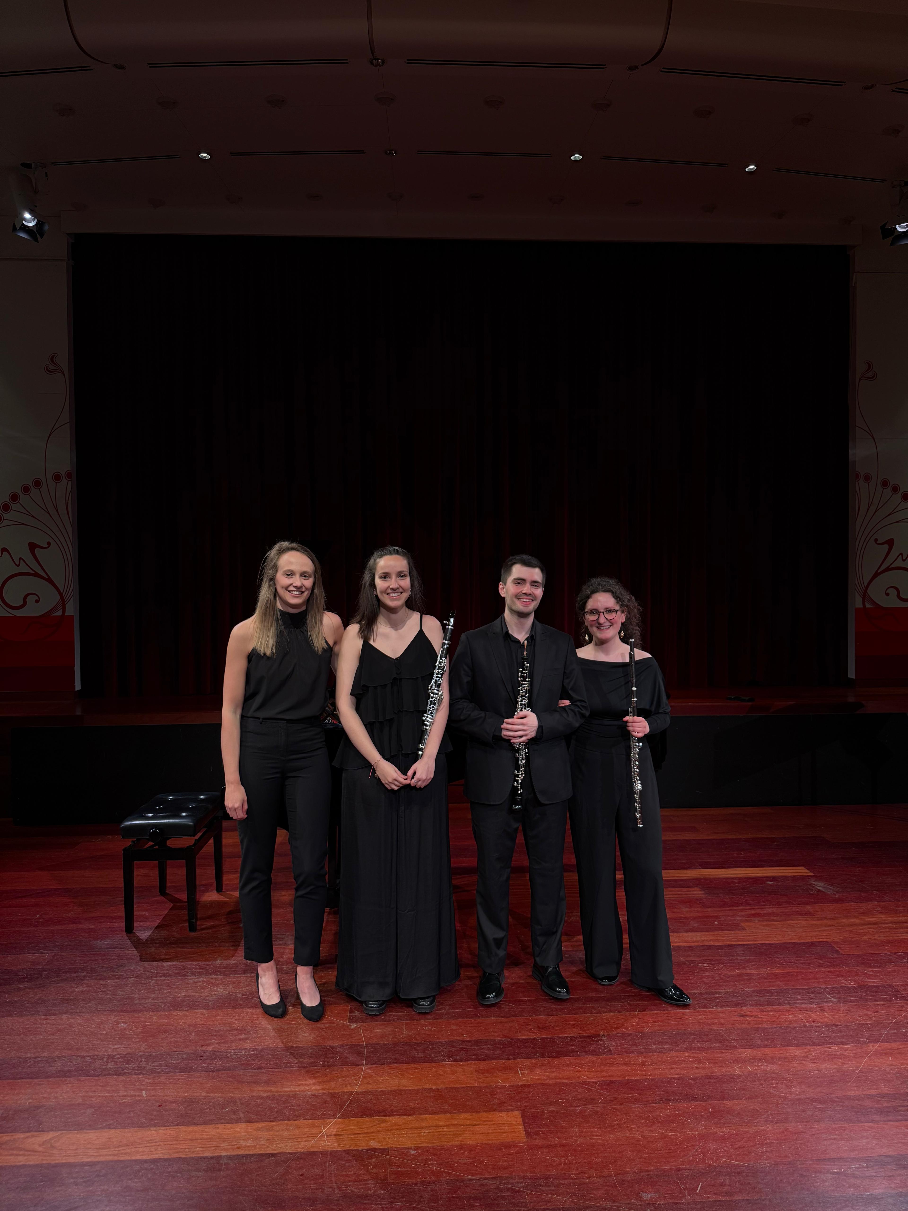 Aer Clave Ensemble on stage with their instruments